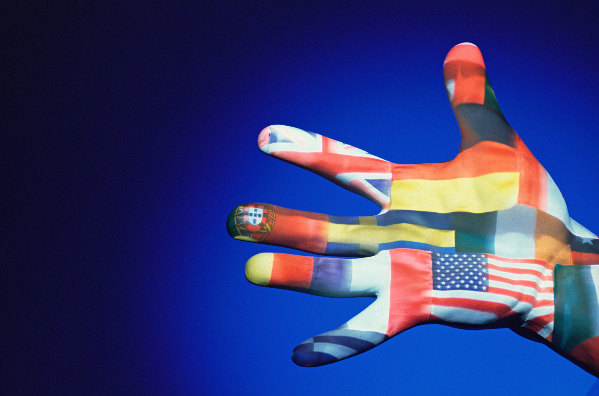Human hand with various flags painted on it