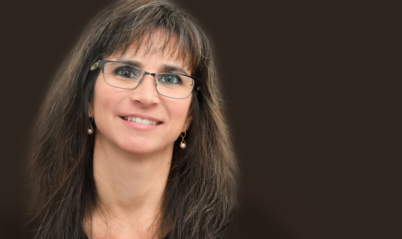 headshot of female with glasses