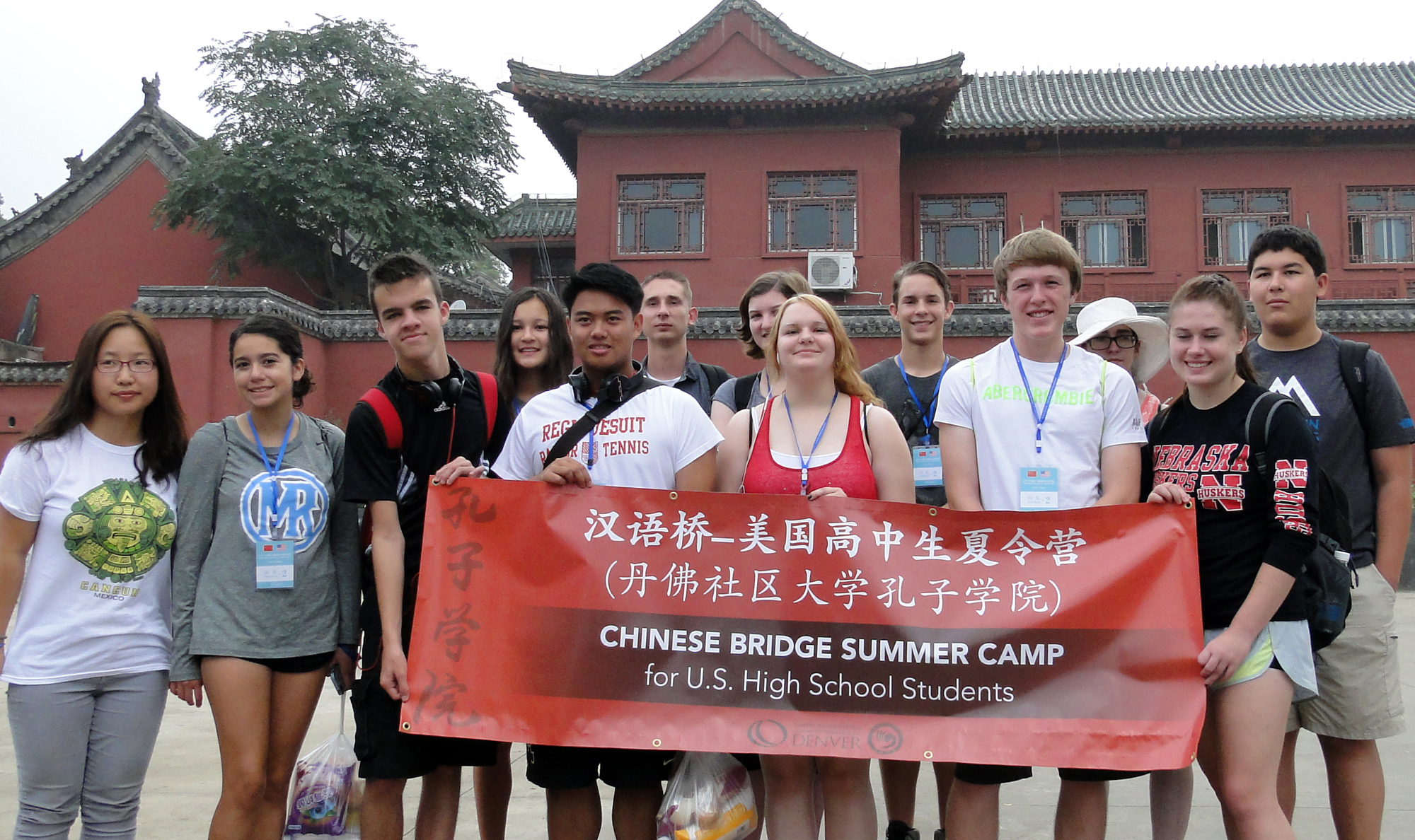 group of students in China holding a red banner