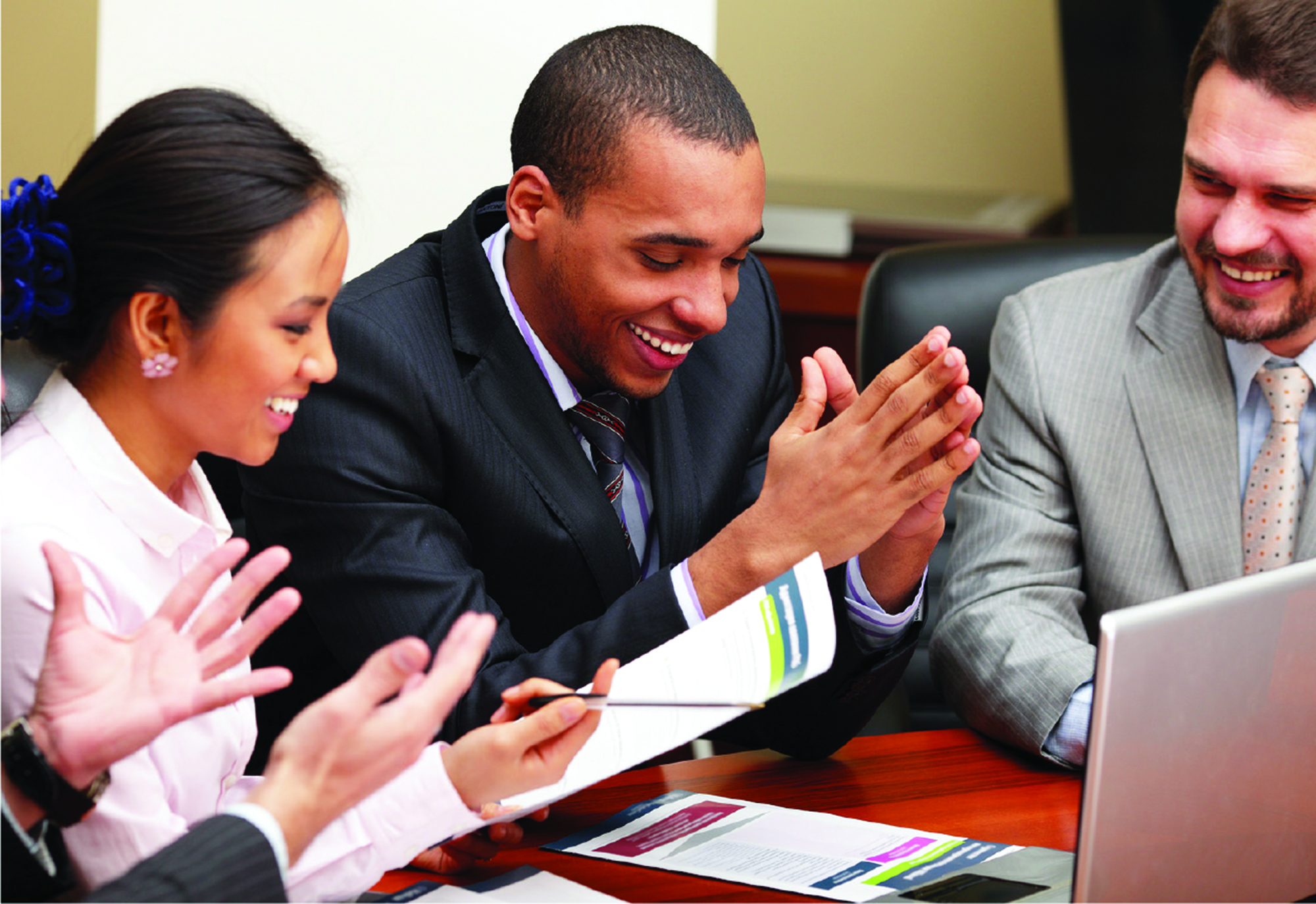 To be successful in business, you need a solid education like CCD's business program. image of a group of people laughing in a business meeting
