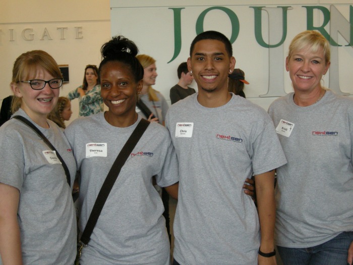 Three CCD students with an instructor at The Denver Post