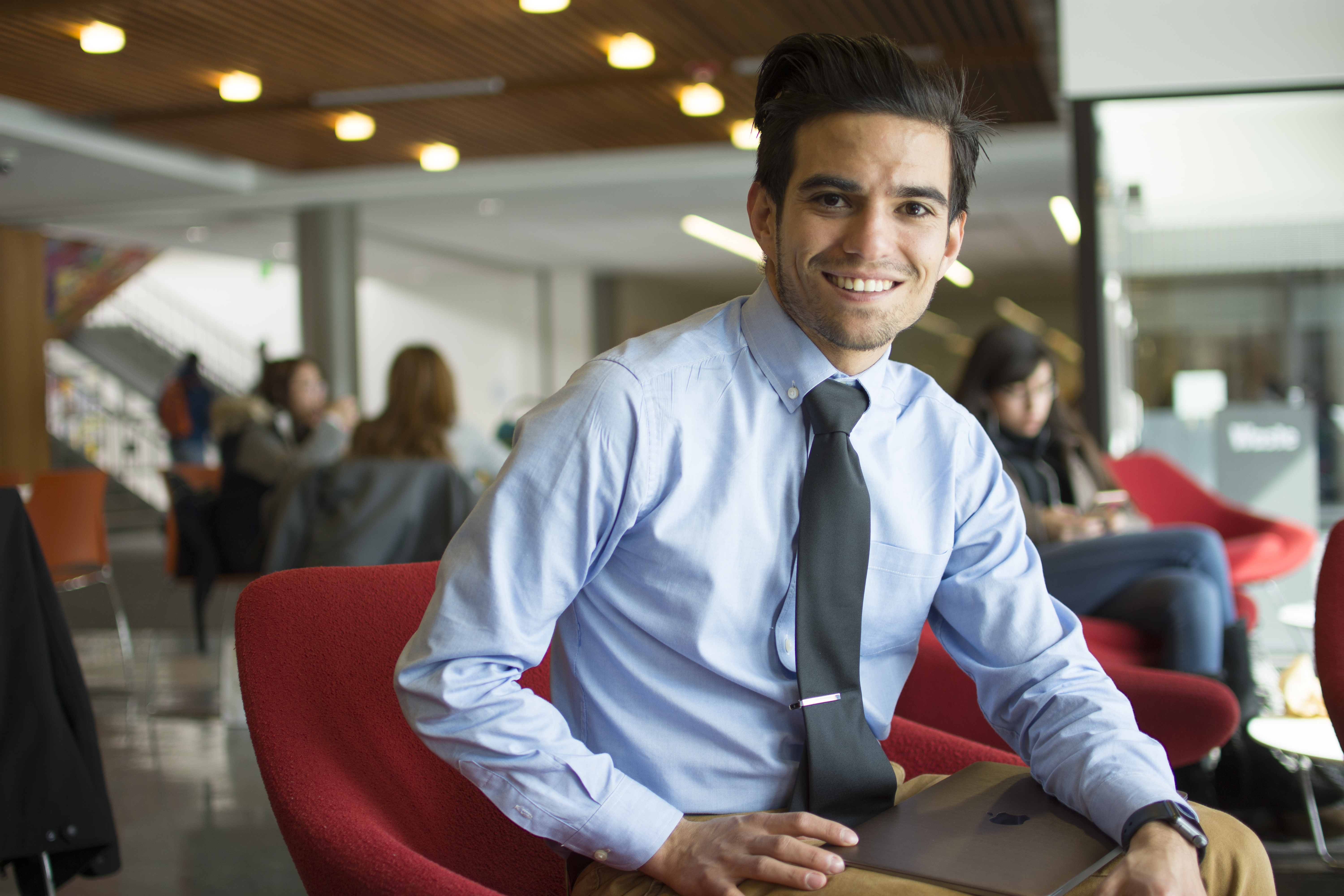 image of male with blue shirt and tie