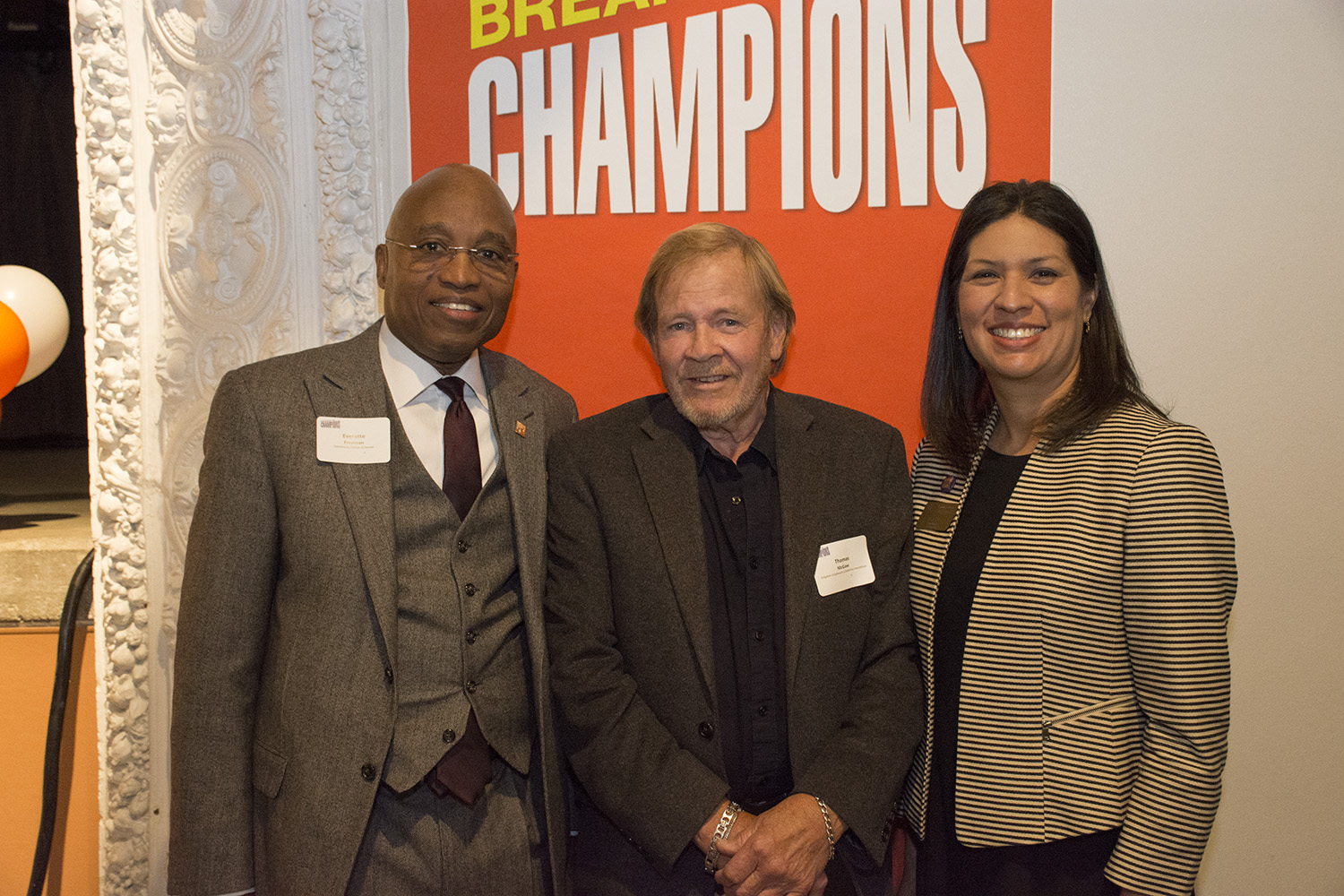 The Sustainability Champion was awarded to the Kingdom Enlightenment Scholarship Foundation three people pose at an award function
