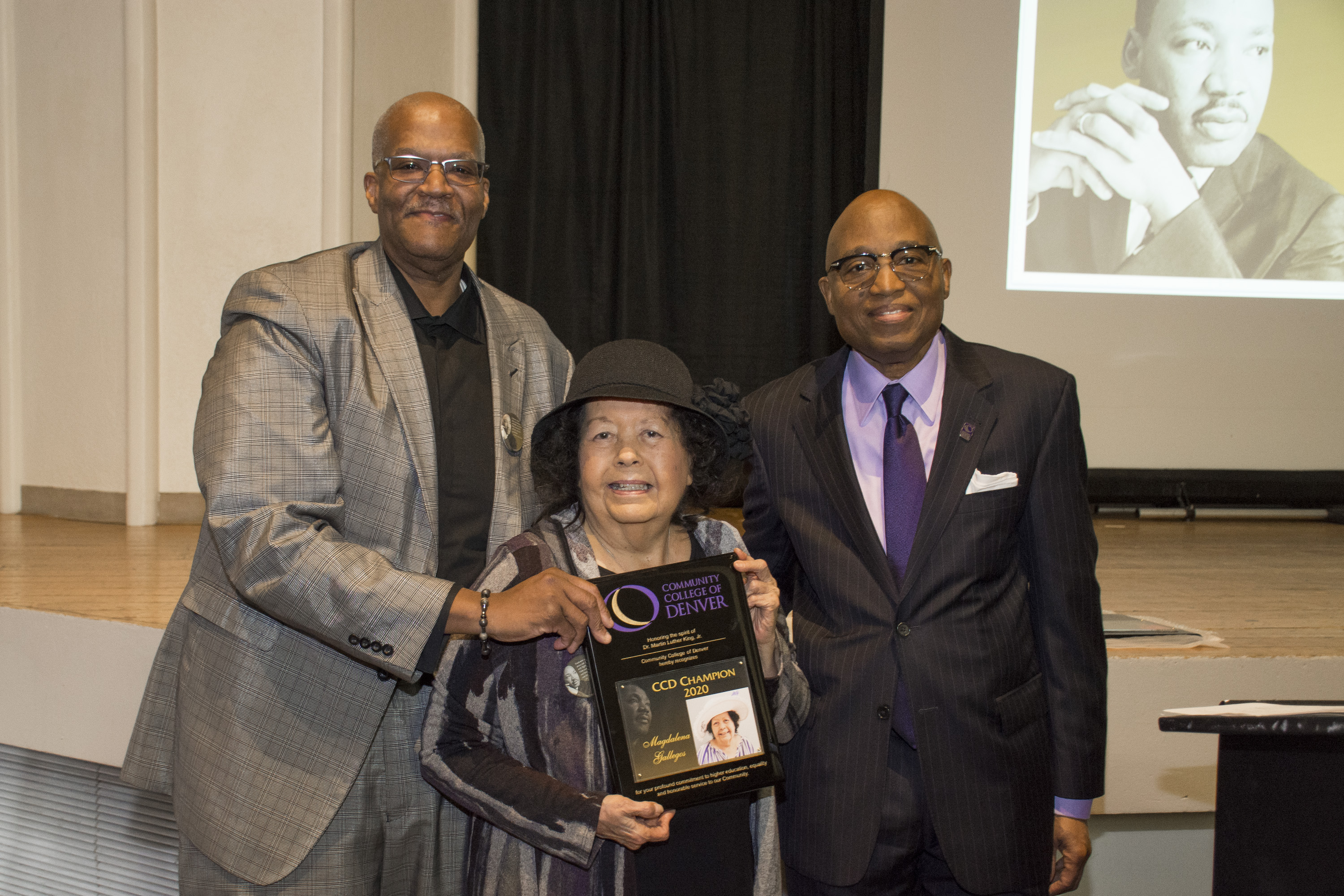 CCD Champion award recipient Magdalena Gallegos with CCD President Everette Freeman and Kevin Williams.