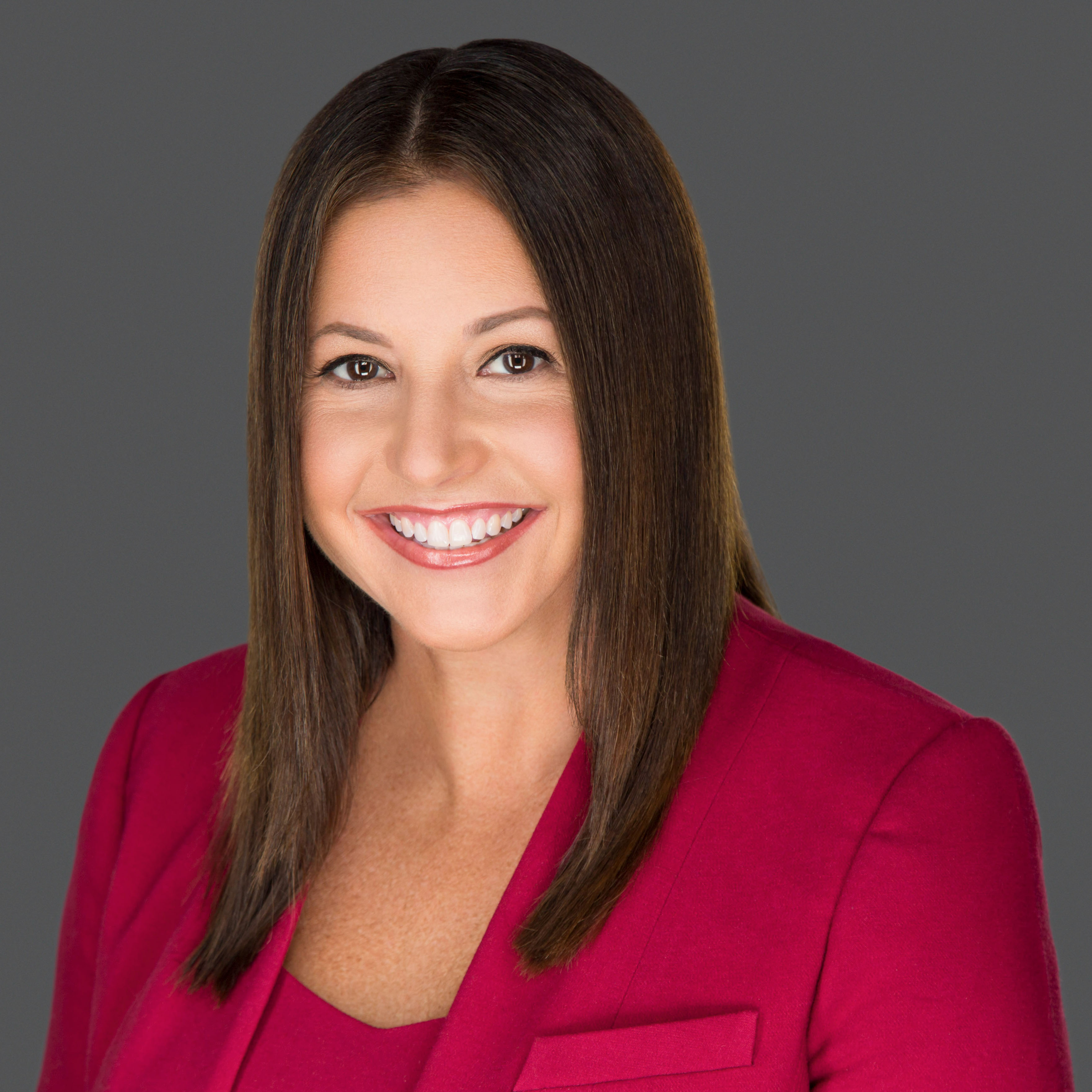 woman wearing a red blazer