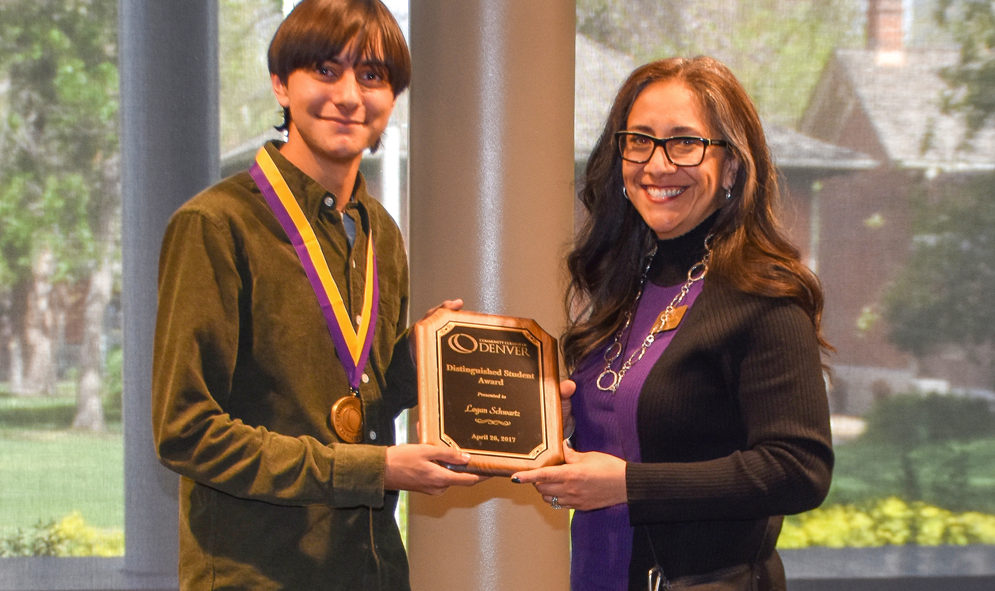 young man being presented the Distinguished Student Award