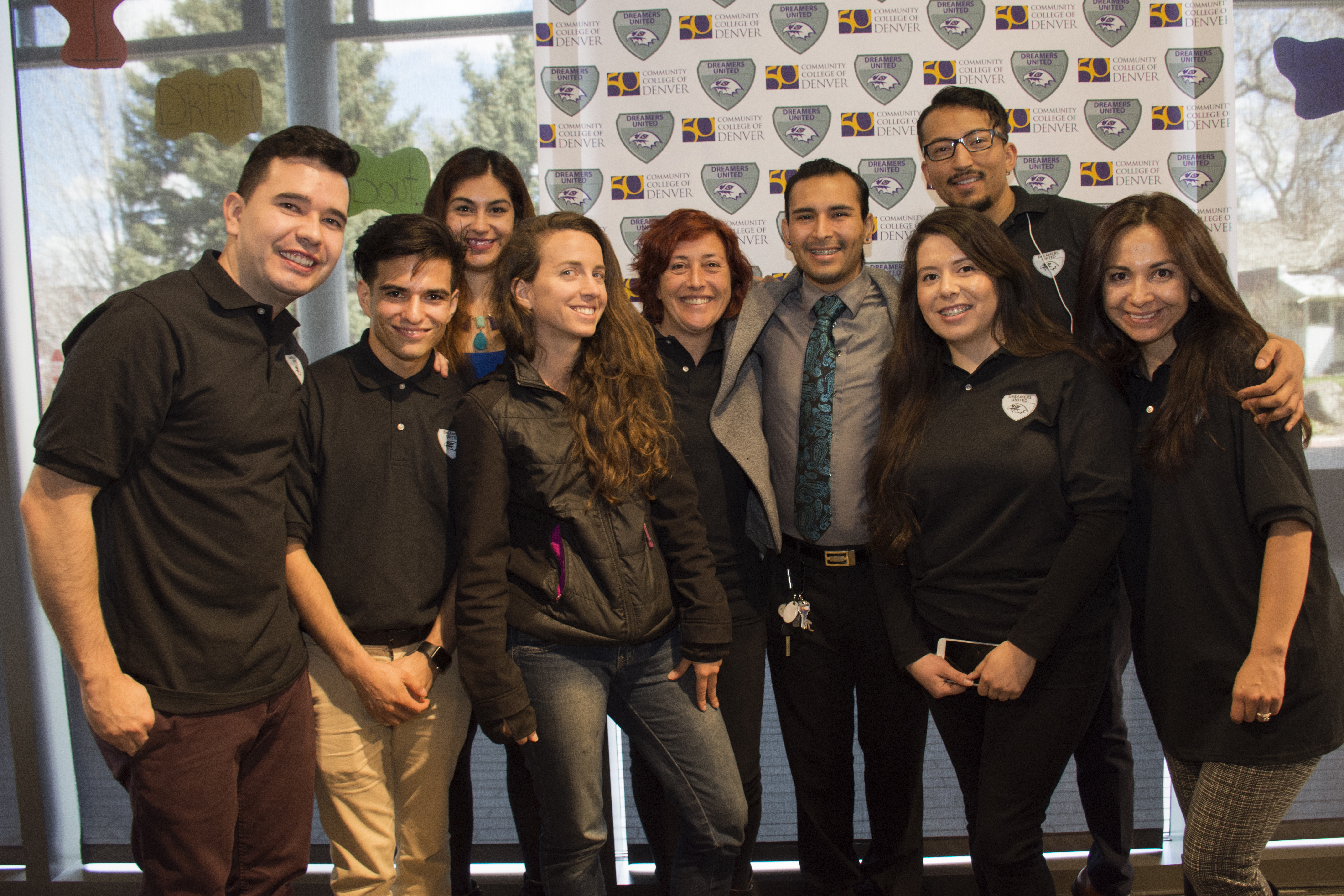 Students attending DREAMers event. students dressed in black at an event
