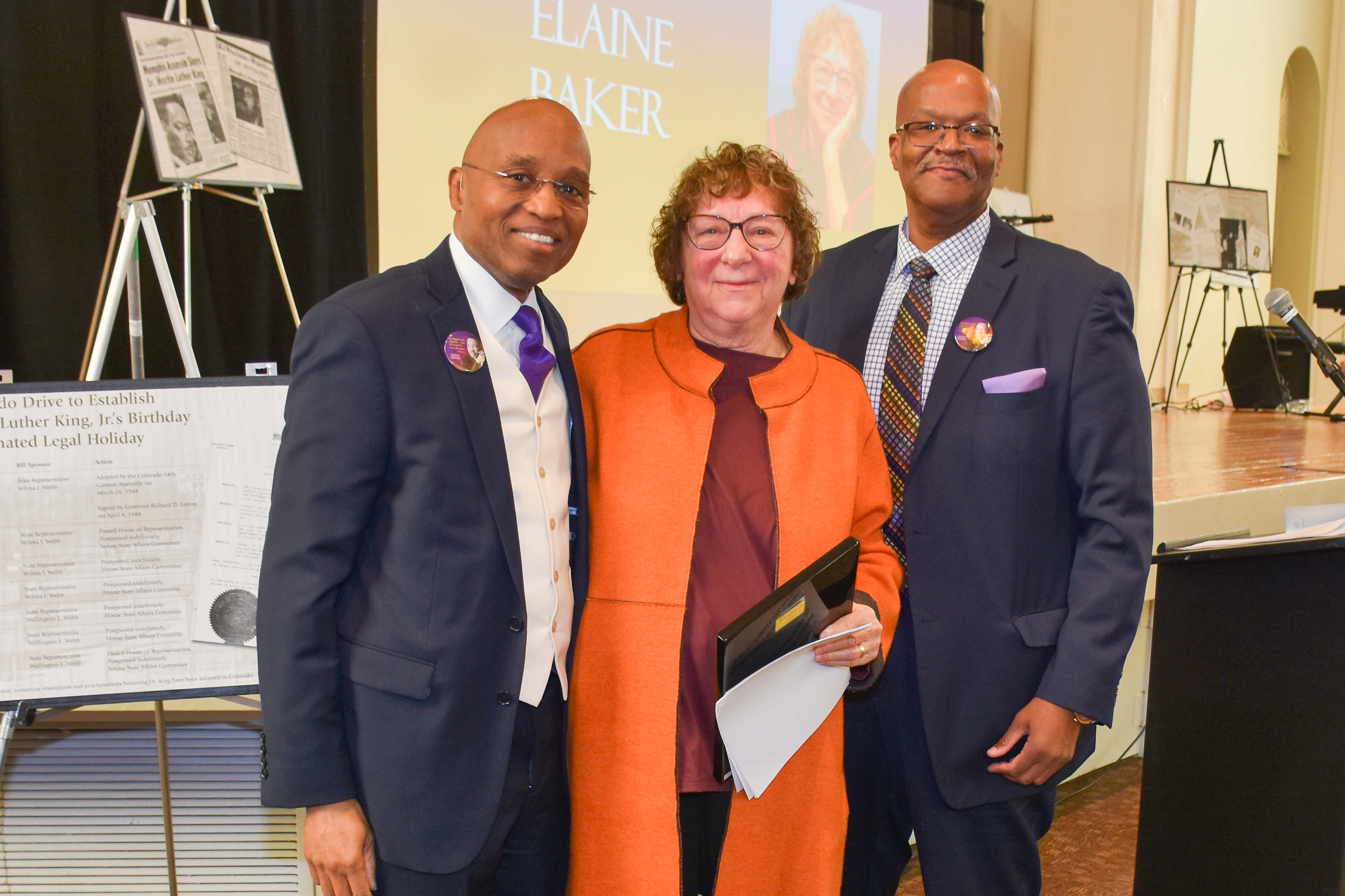 CCD Champion Elaine Baker two black men and one white woman standing together