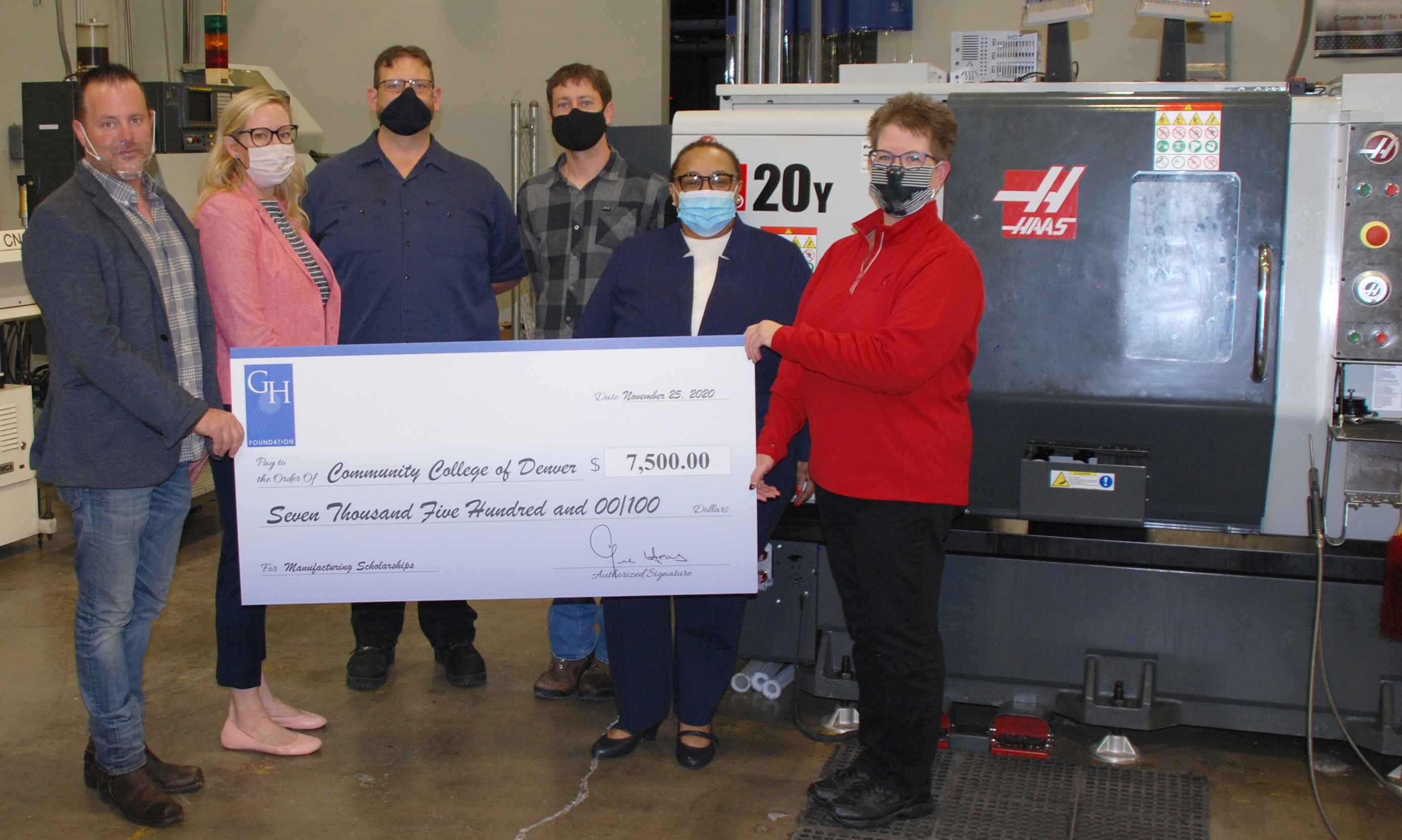 Gene Haas Foundation representatives present ceremonial check to CCD staff