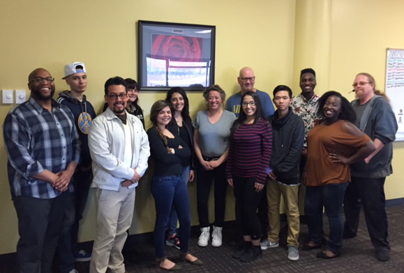 group of staff and students standing together smiling