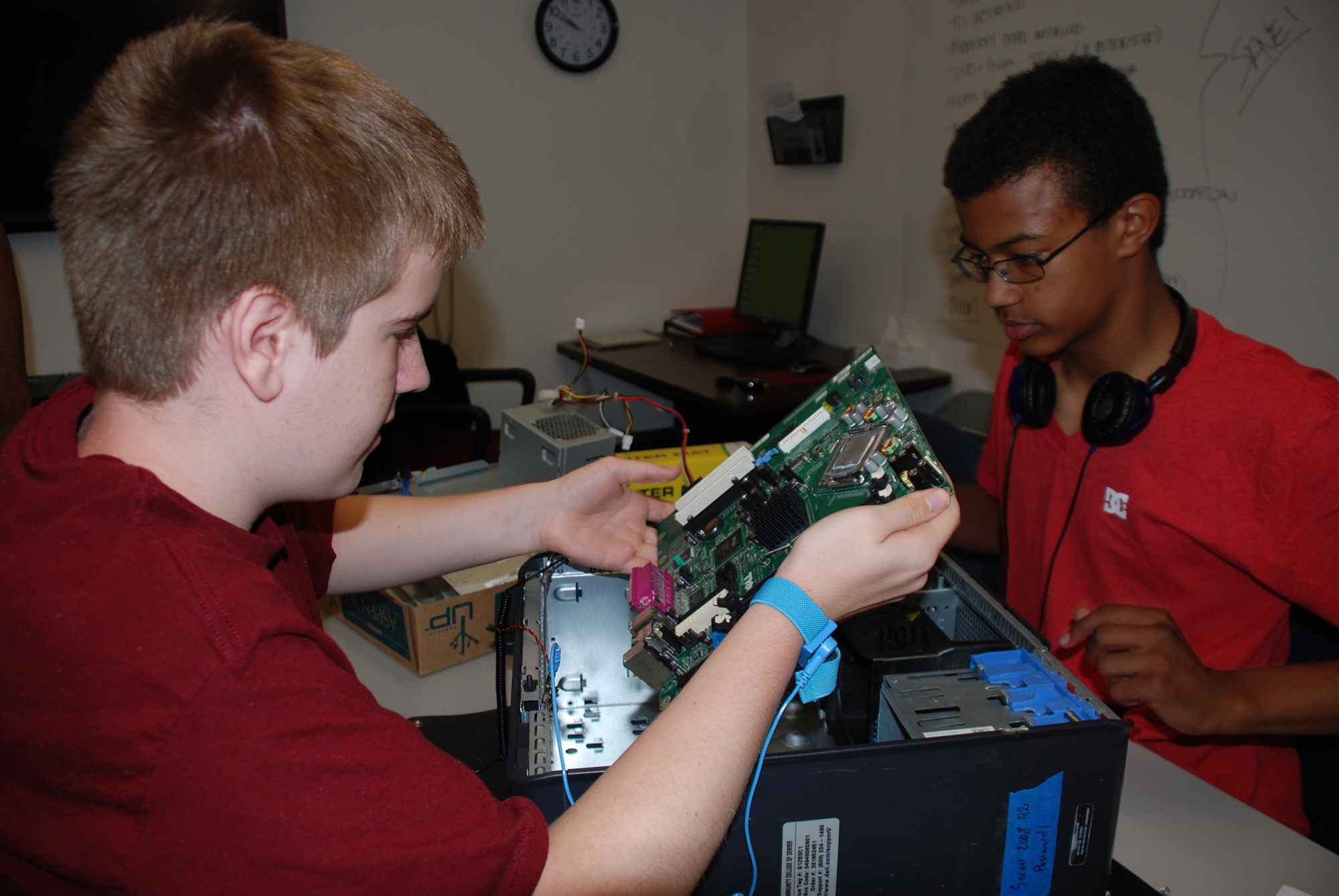 Two children building a computer