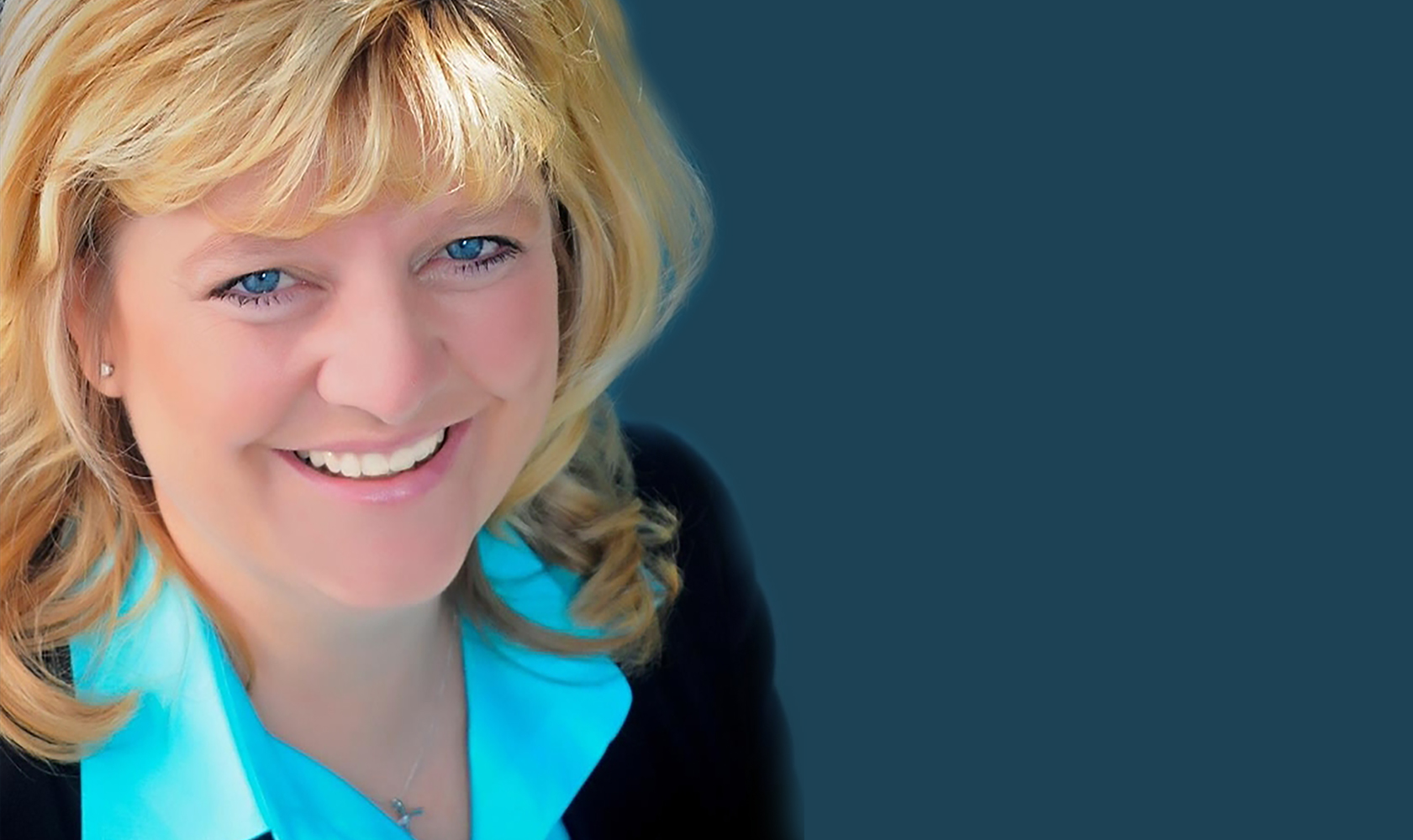 headshot of female with blue shirt