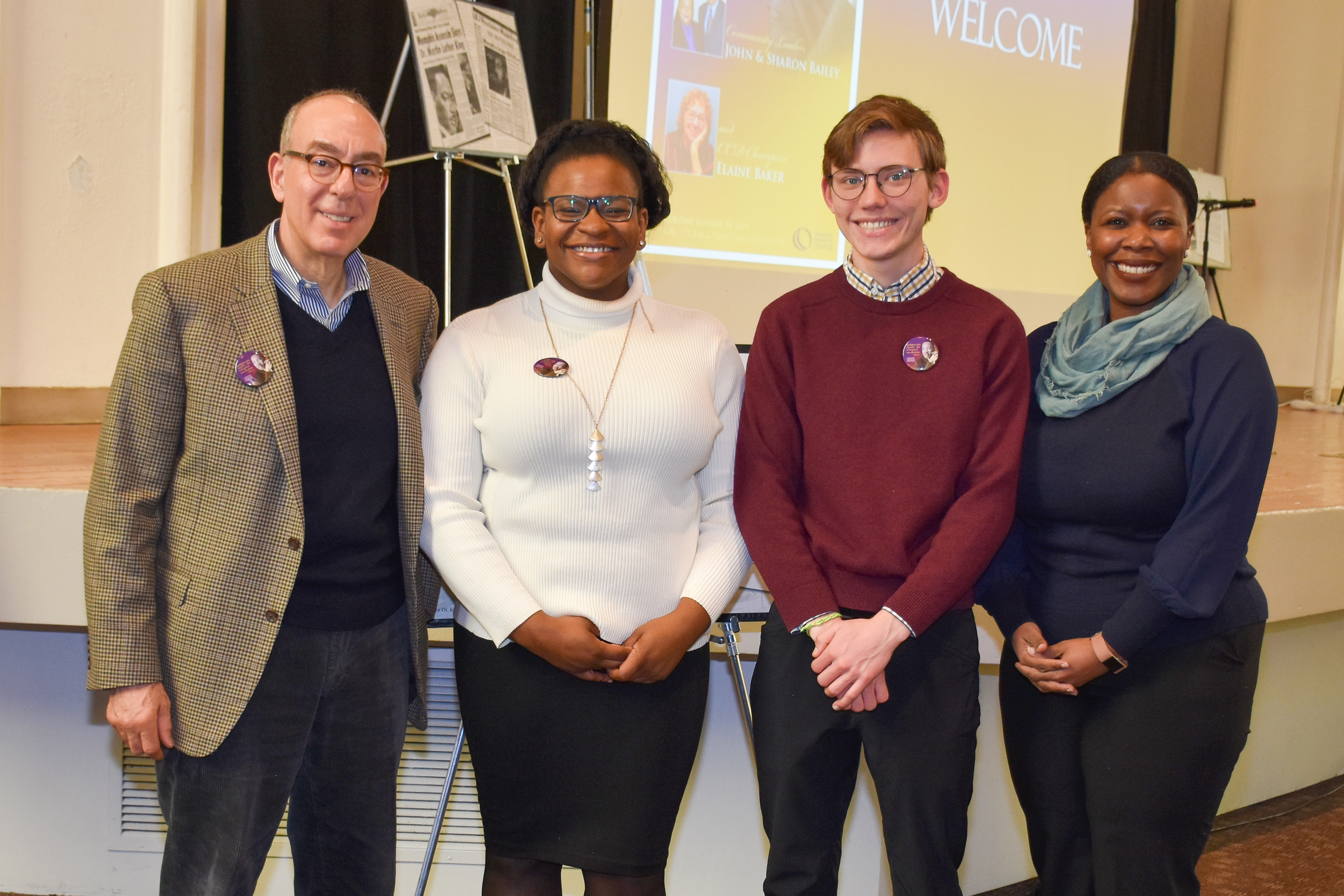 CCD MLK Scholars Jasmine White and James McDermott pictured with CCD Foundation board members Gregory Movensian (pictured far left) and Monique Dyers (pictured far right). two white men standing with two black women smiling