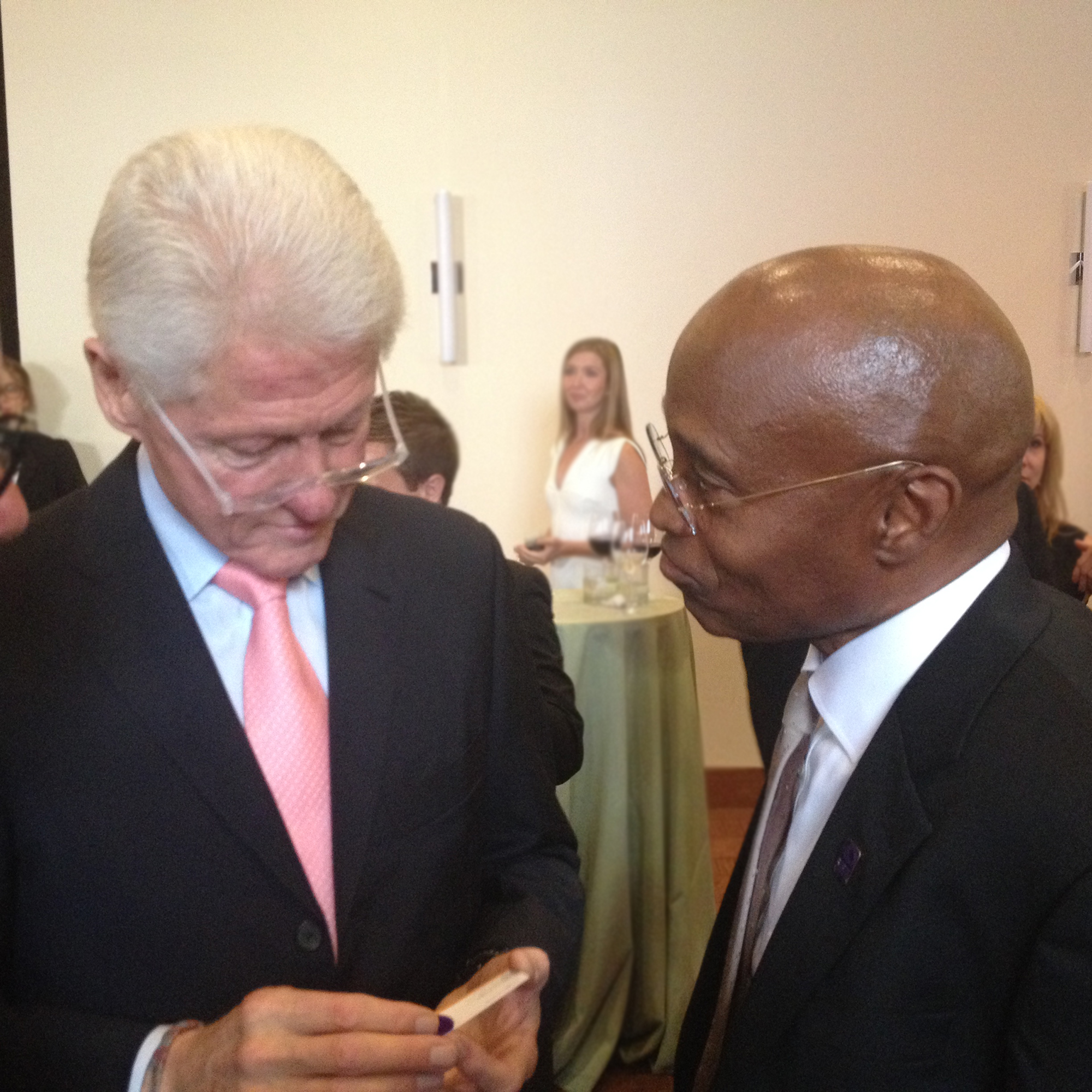 CCD President Everette Freeman Meets Former President Bill Clinton two prominent men in suits in a one-on-one discussion