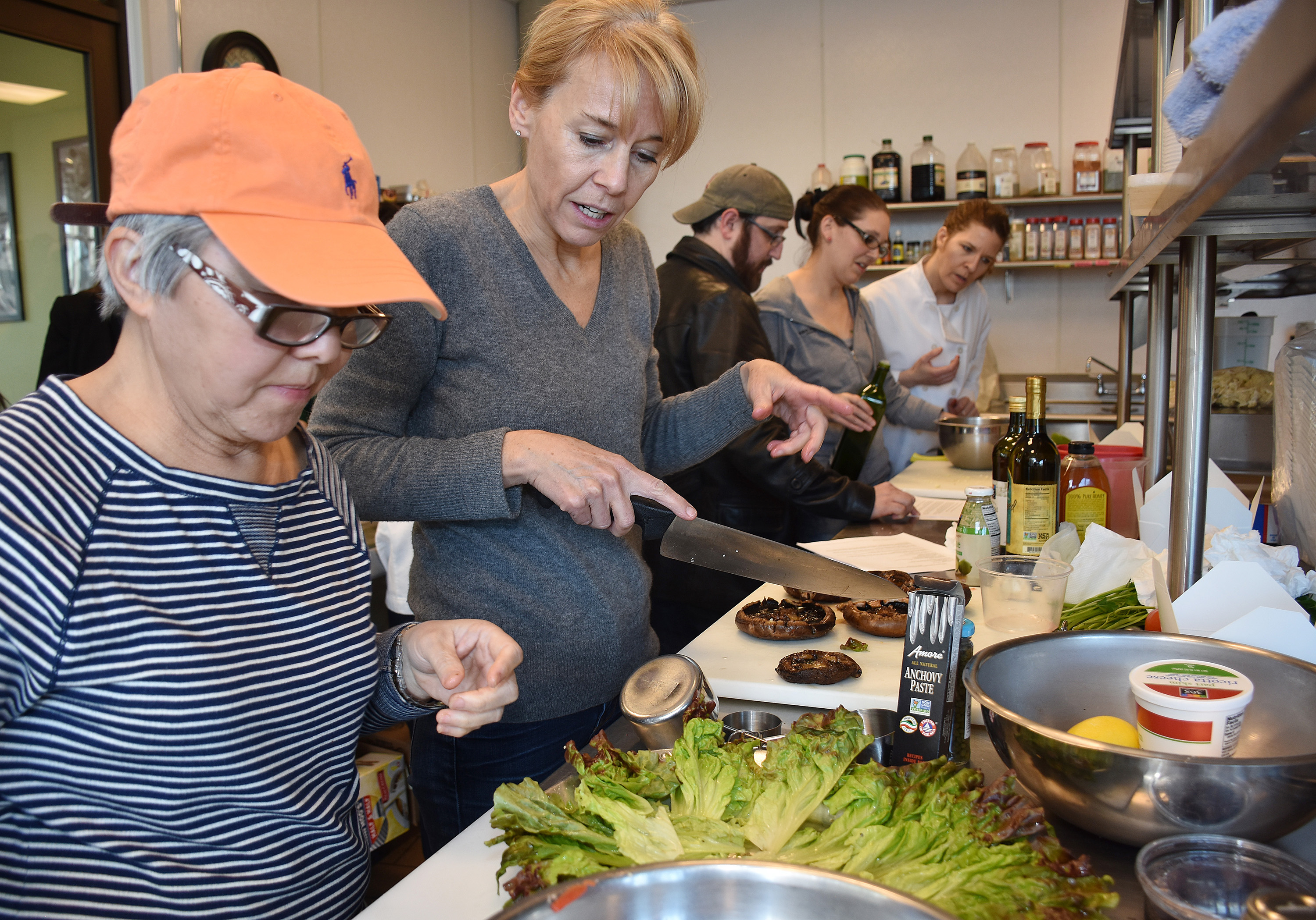 two women in the kitchen cooking