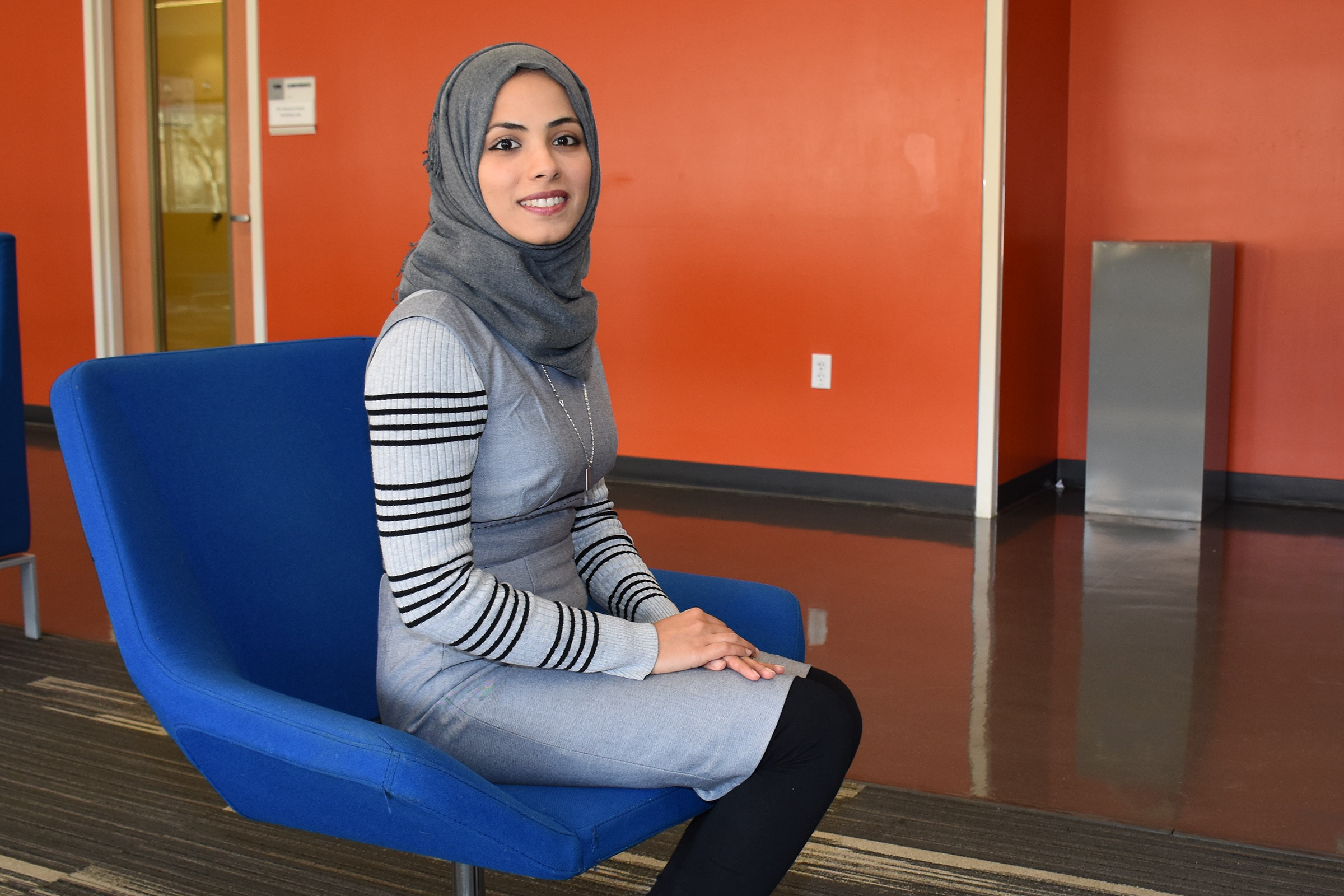 CCD Student Ola AlSaadi muslim female student sitting and smiling