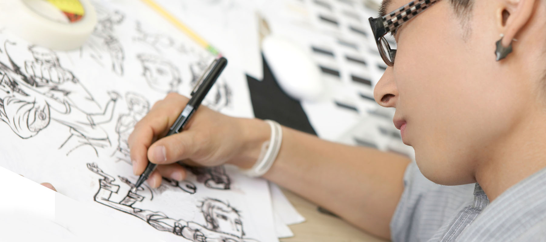 artist working on a black and white drawing