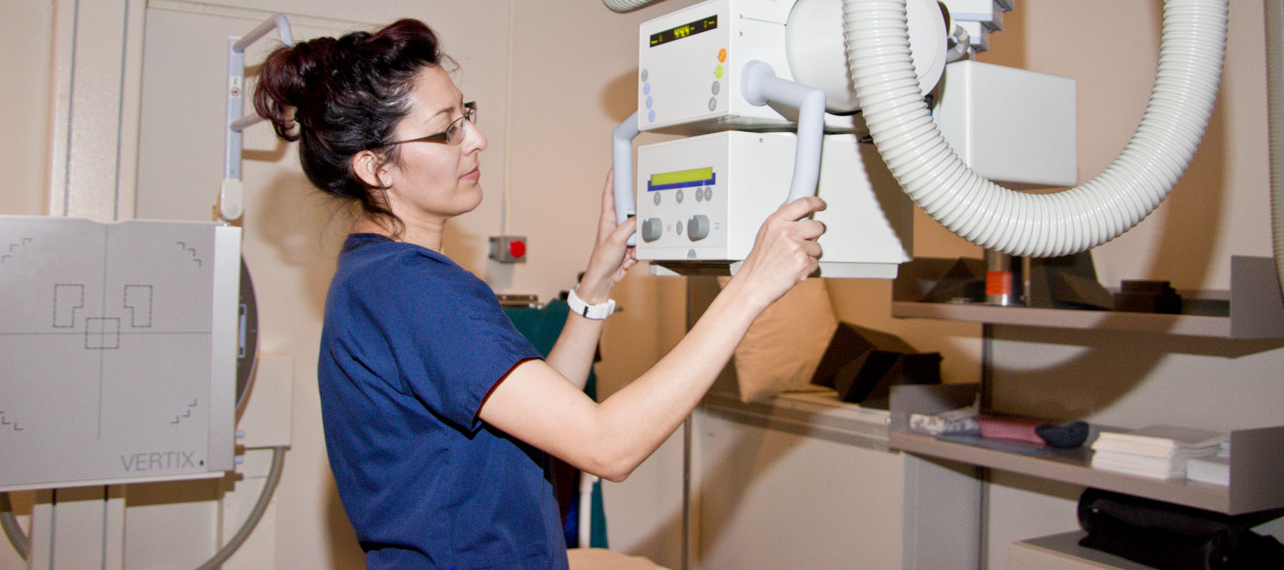 female radiologist with xray machine