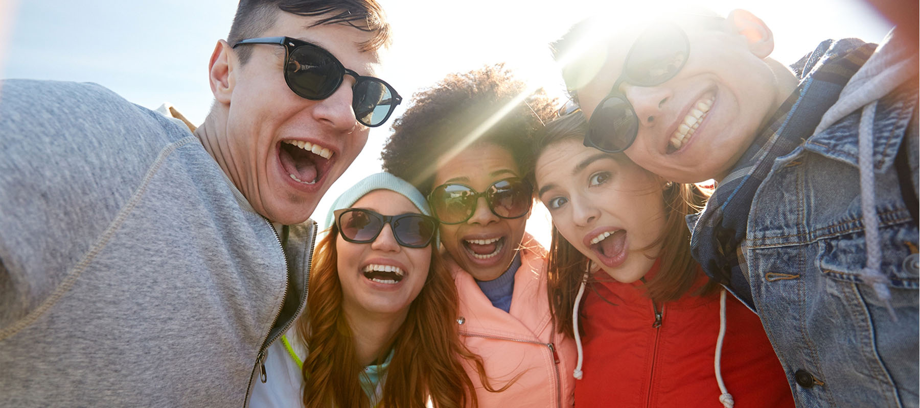 students smiling with sunglasses
