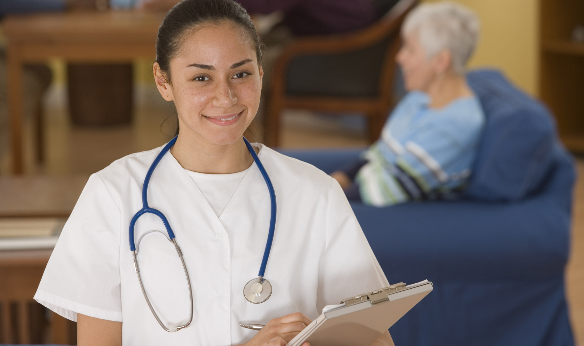 Become a medical assistant with CCD's program young medical worker with clipboard