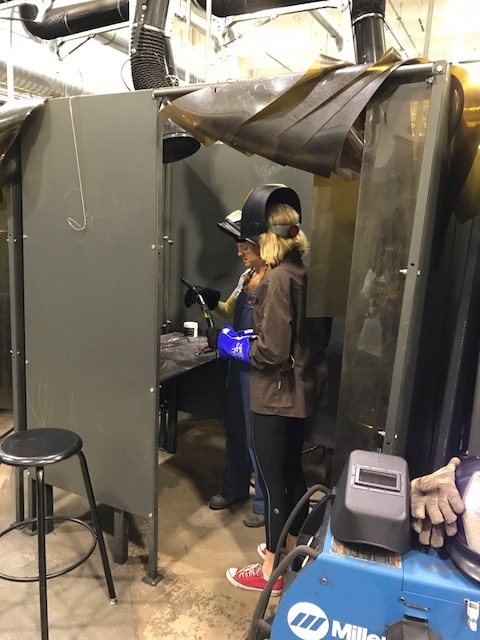 two females welding