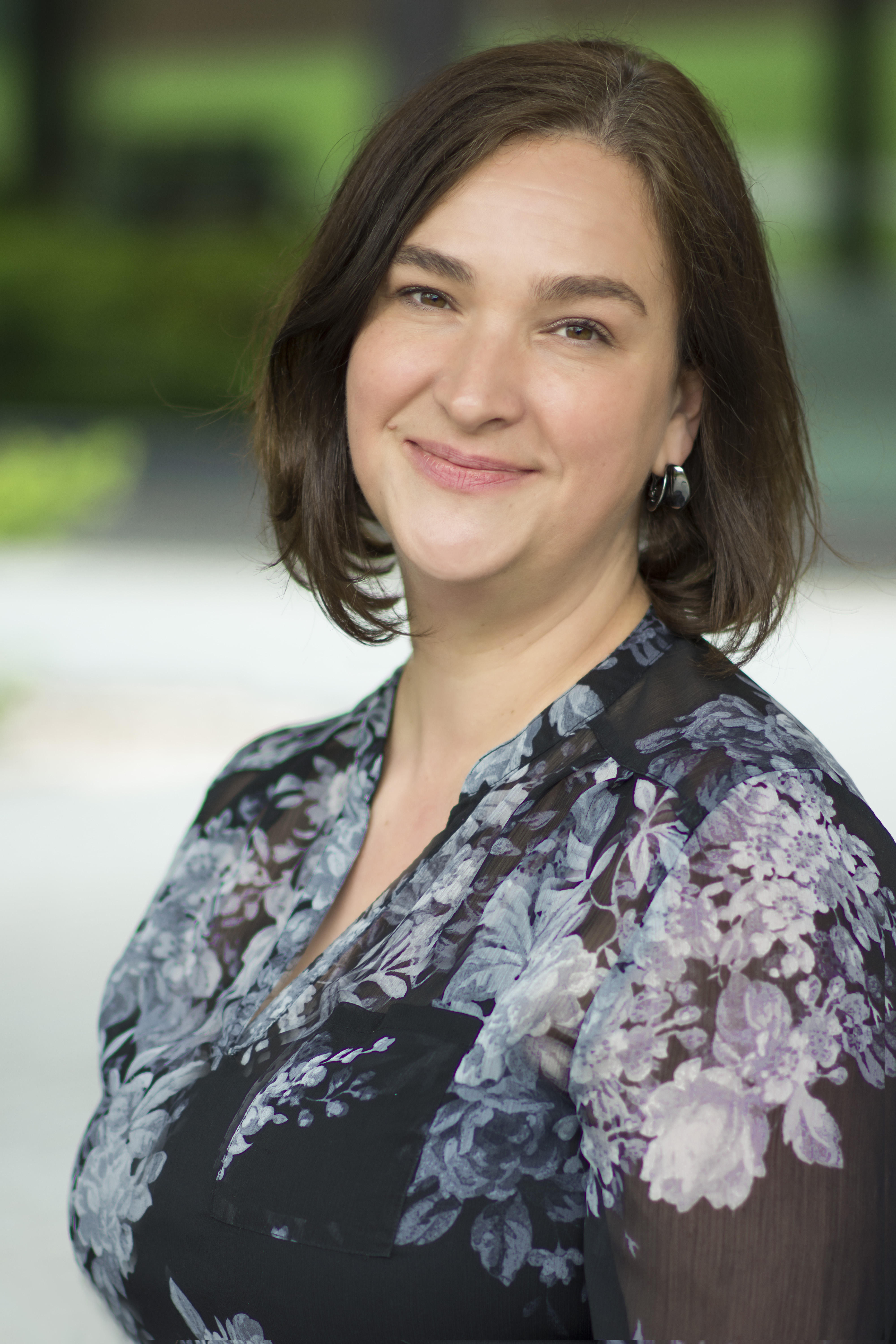 headshot of woman in flowery shirt