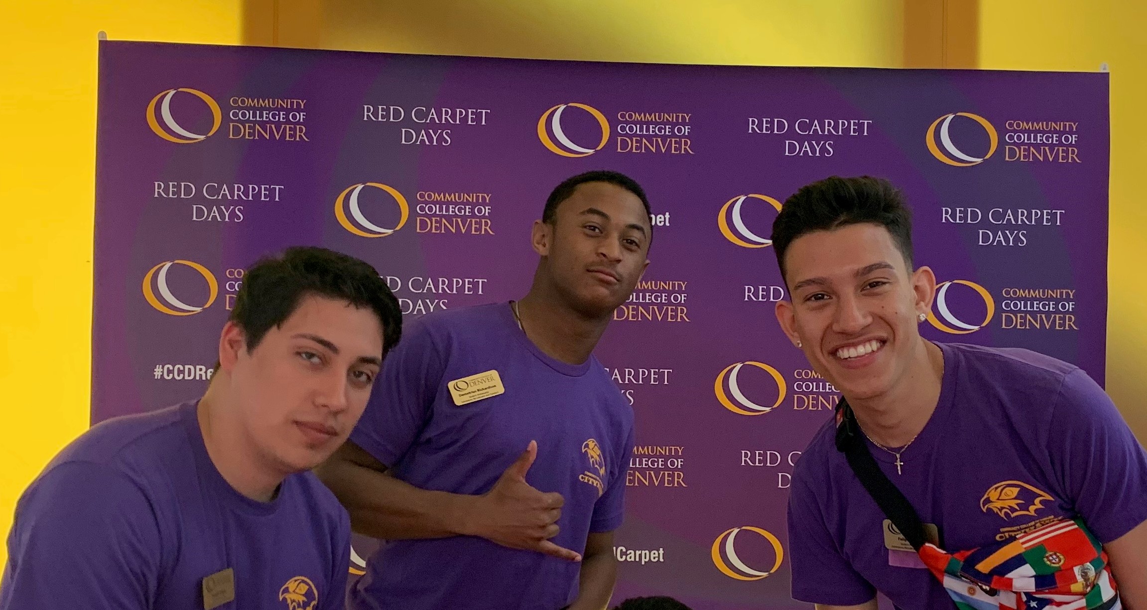 three males with purple CCD shirts posing three males with purple CCD shirts posing