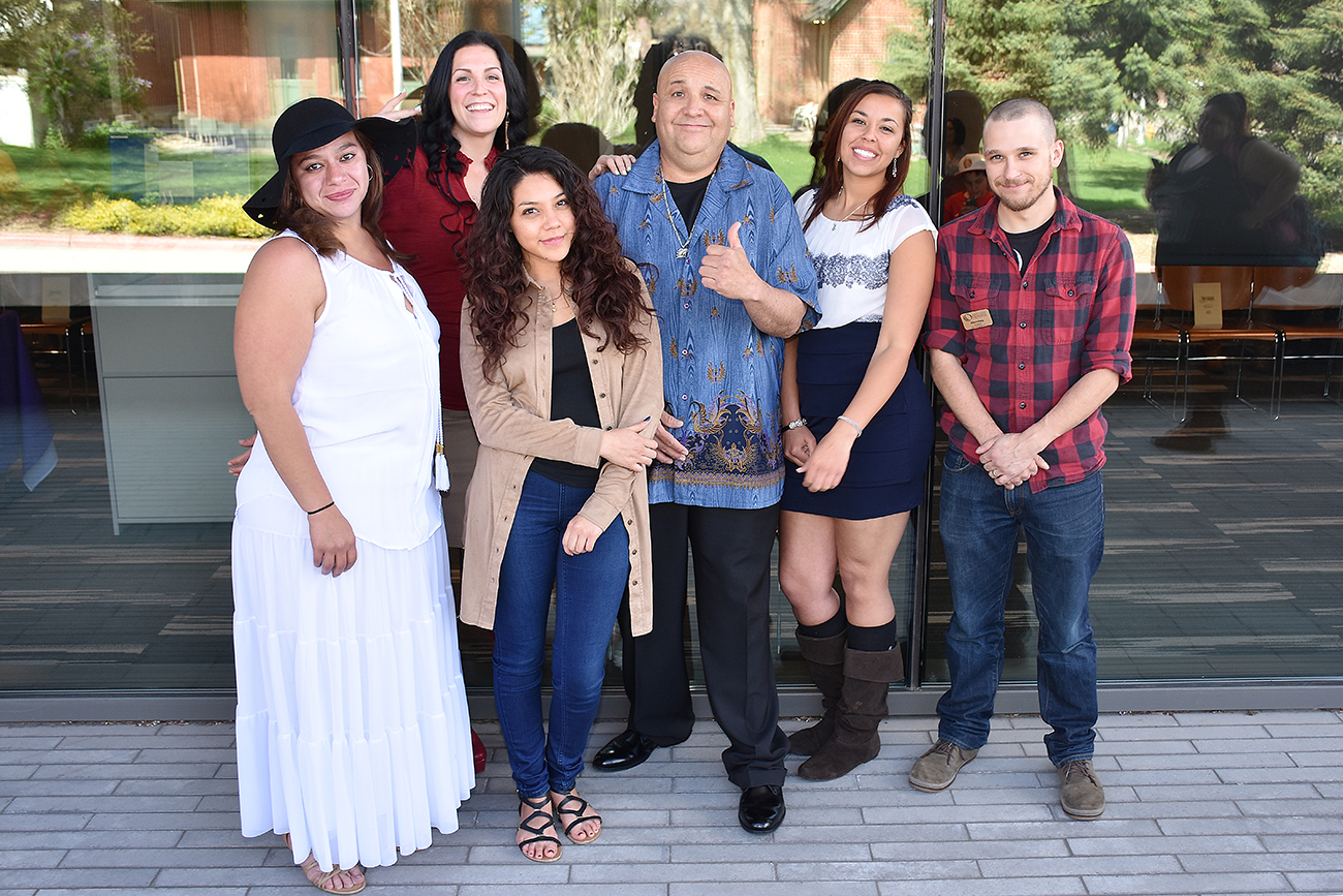 a group of college students standing outside smiling