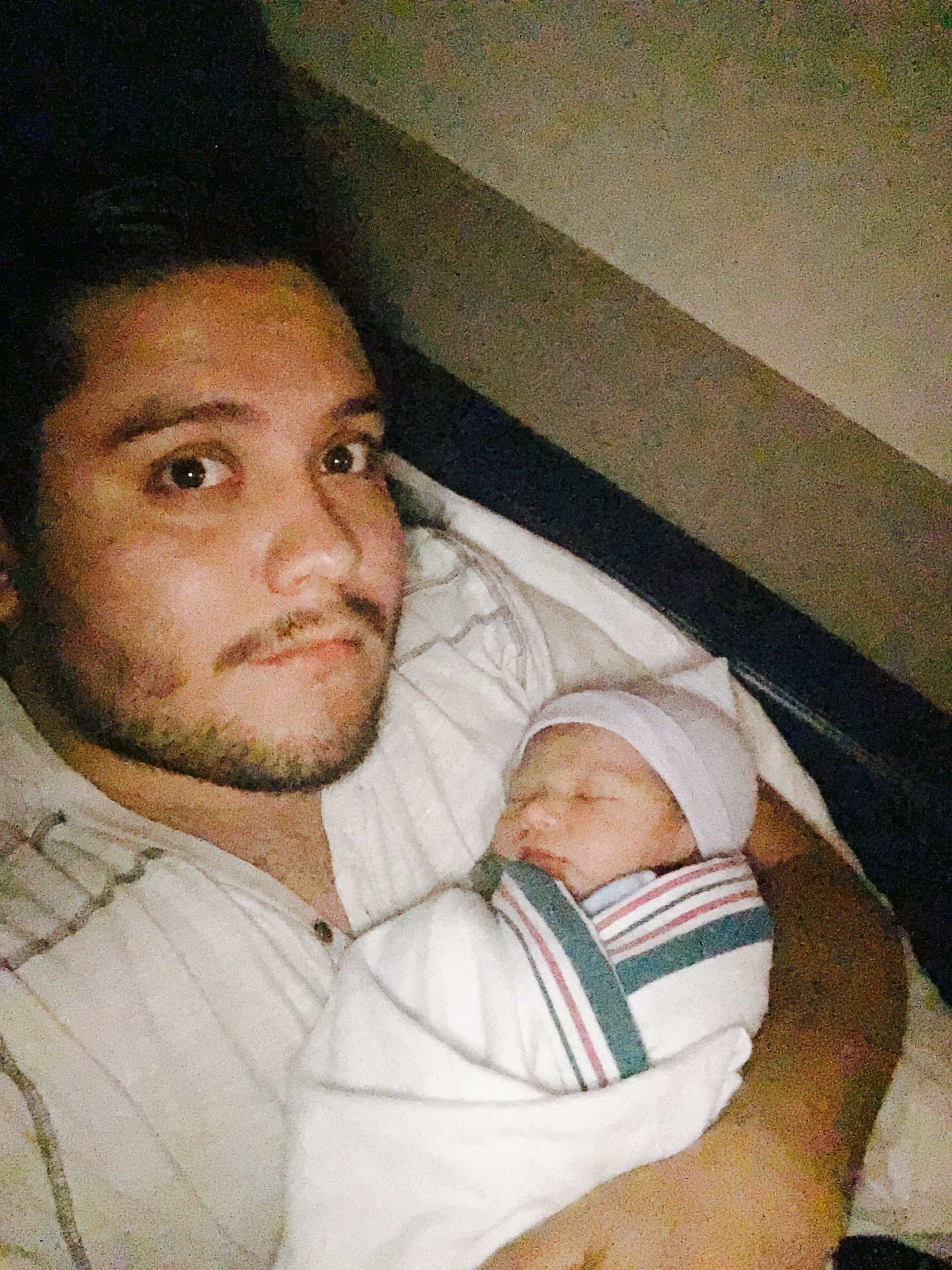 man with newborn baby