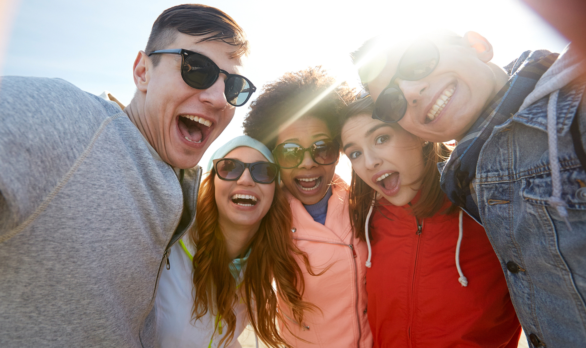 students smiling with sunglasses