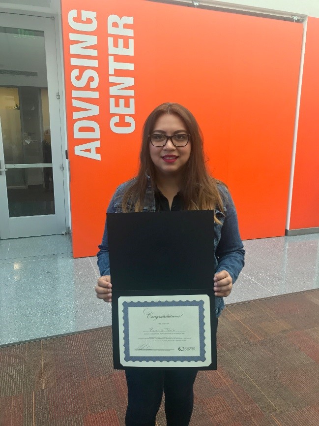 Berenice Toledo, Gateway Scholarship Recipient girl holding certificate