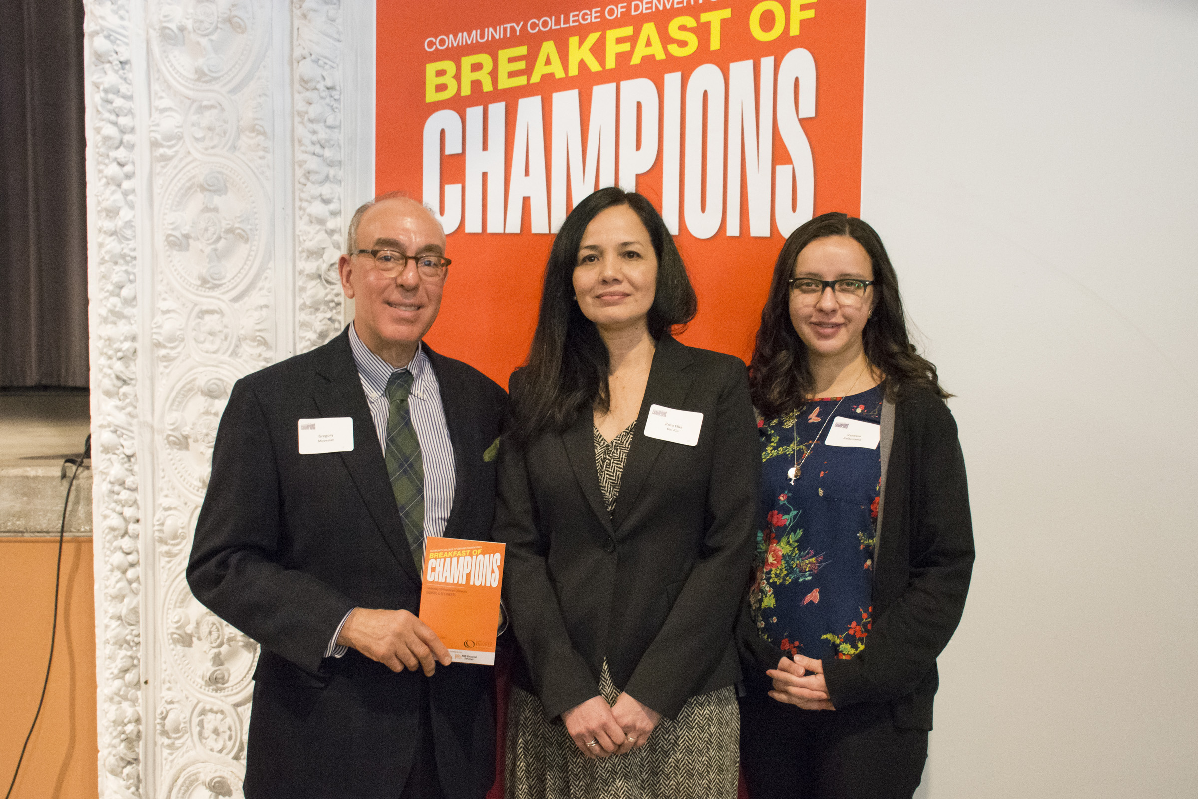Engagement Champion | TheDream.US a man next two to females