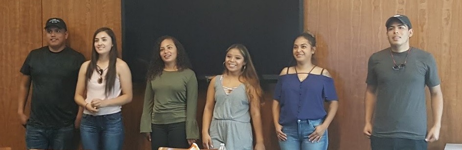 a group of students lined up smiling