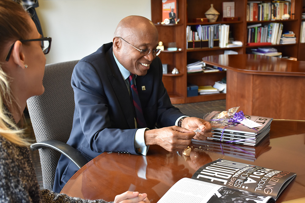 Everette with student in his office