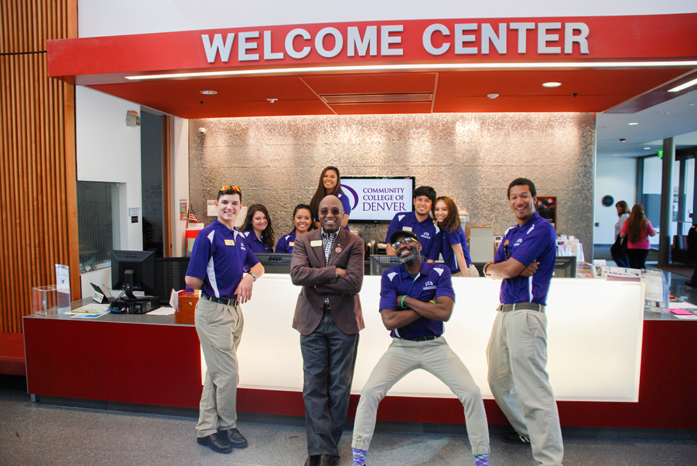 Everette in front of Welcome Center with students