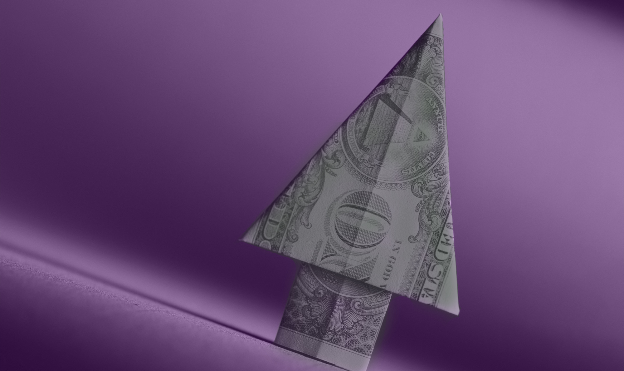 dollar bill folded into an arrow