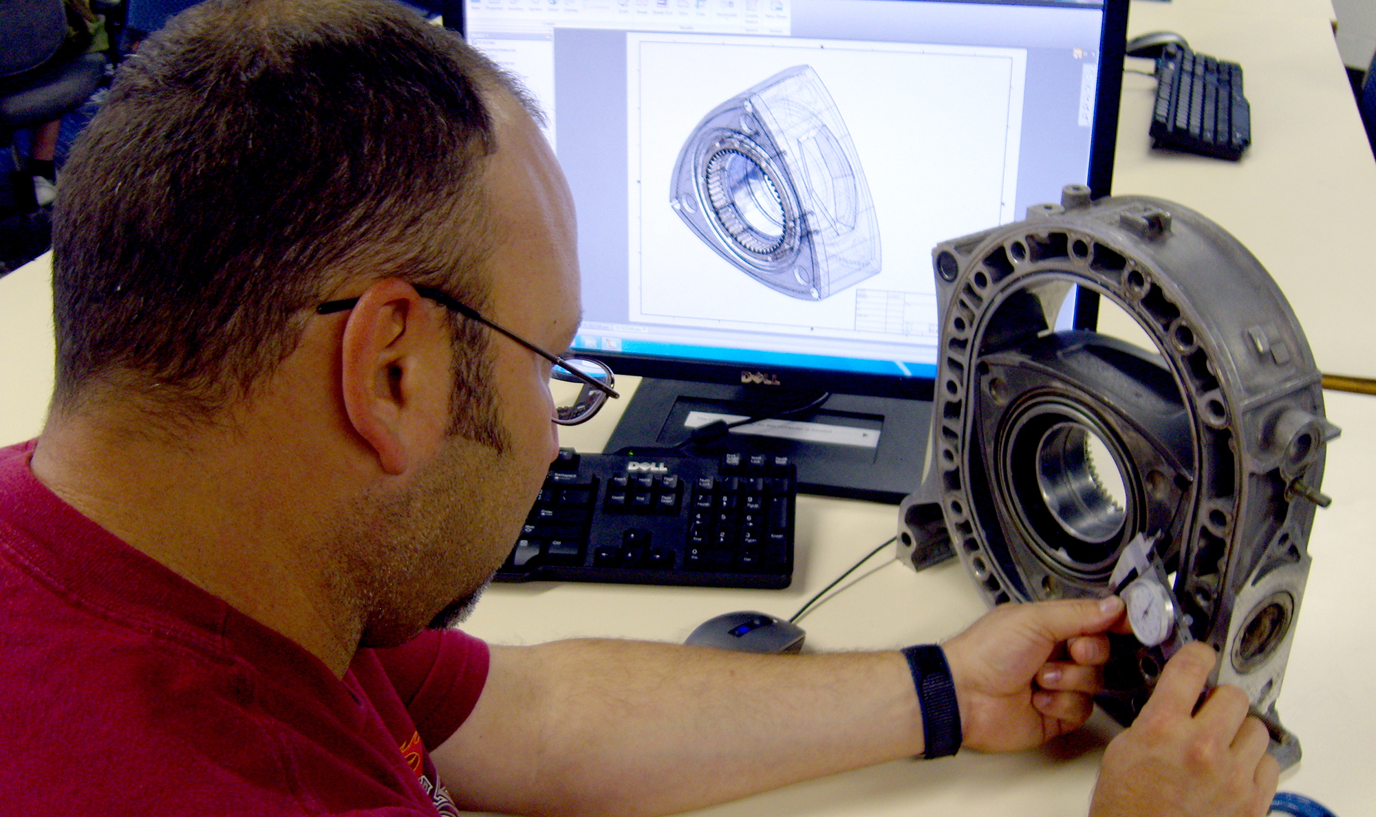 person measuring rotary motor