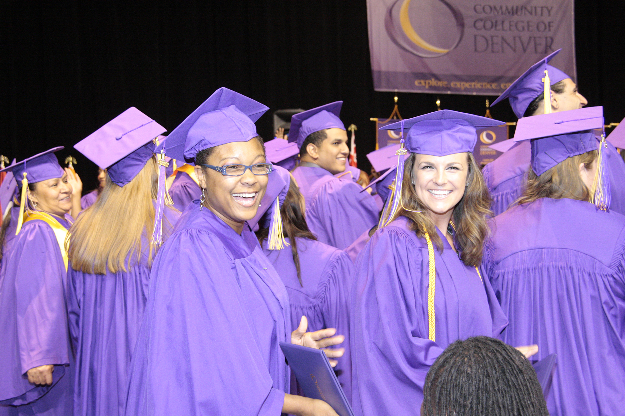 Group of CCD Graduates wearing purple graduation gowns at the 2014 Commencement Ceremony