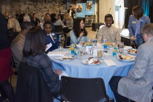 group of people seated at table eating