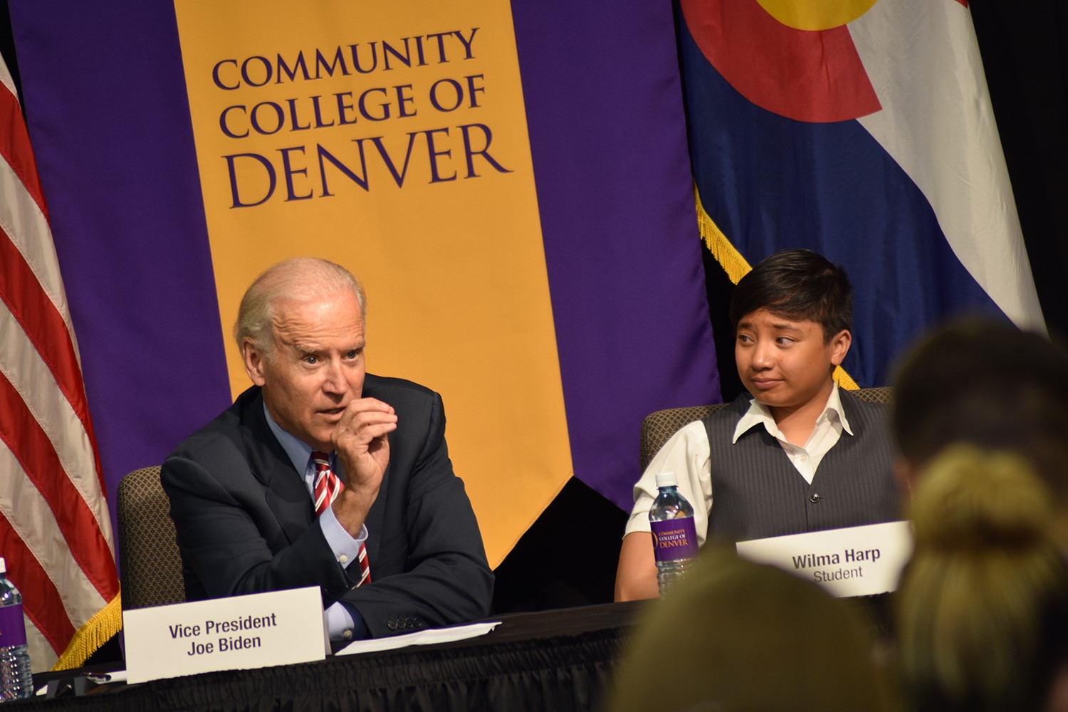 picture of Vice President Joe Biden and CCD student in front of a Community College of Denver sign.