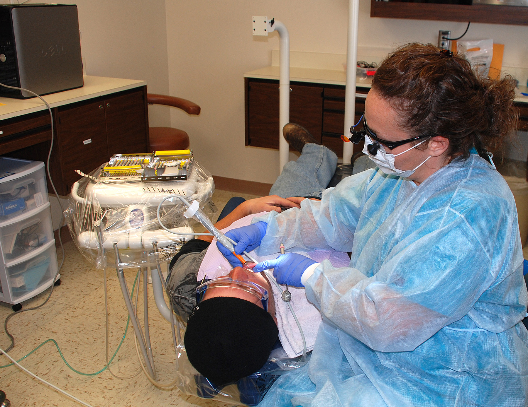 dental hygienist working on a patient