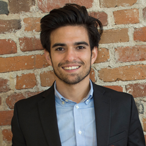 young man with dark hair wearing suit jacket