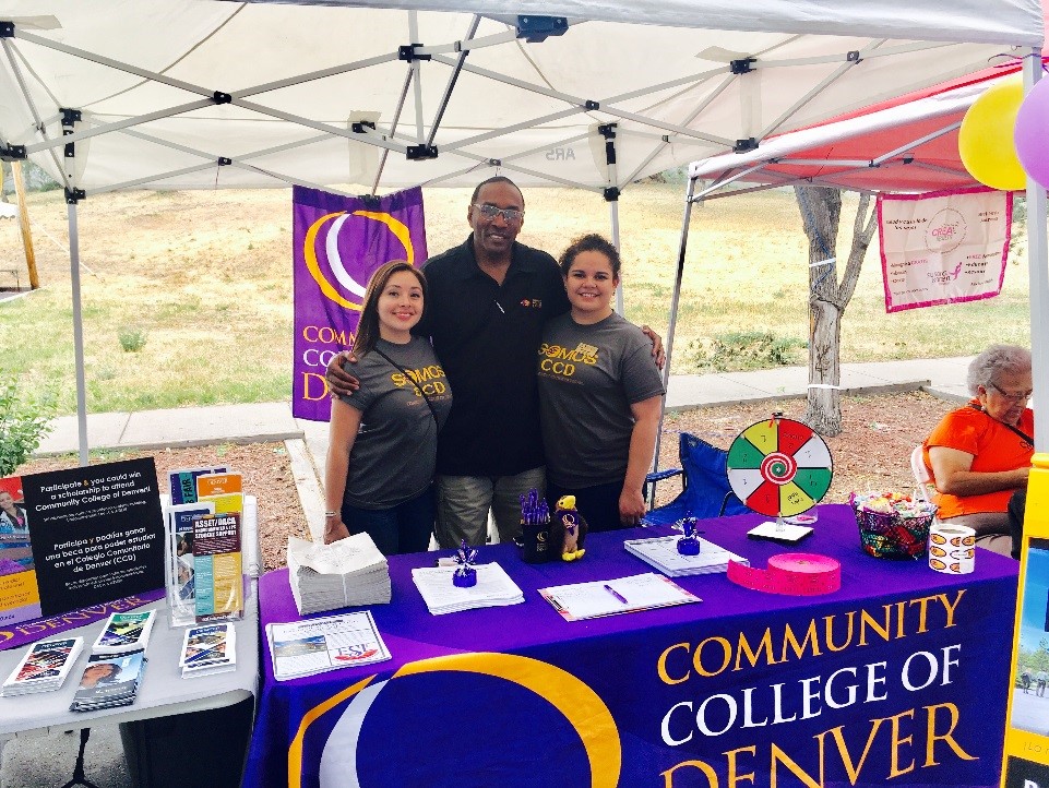 l-r: Melanie Romero-Scholarship Coordinator, Mark Harper-Senior Recruiter & Enrollment Counselor, Marisol Gonzalez-Bilingual Recruiter three people standing behind a CCD table