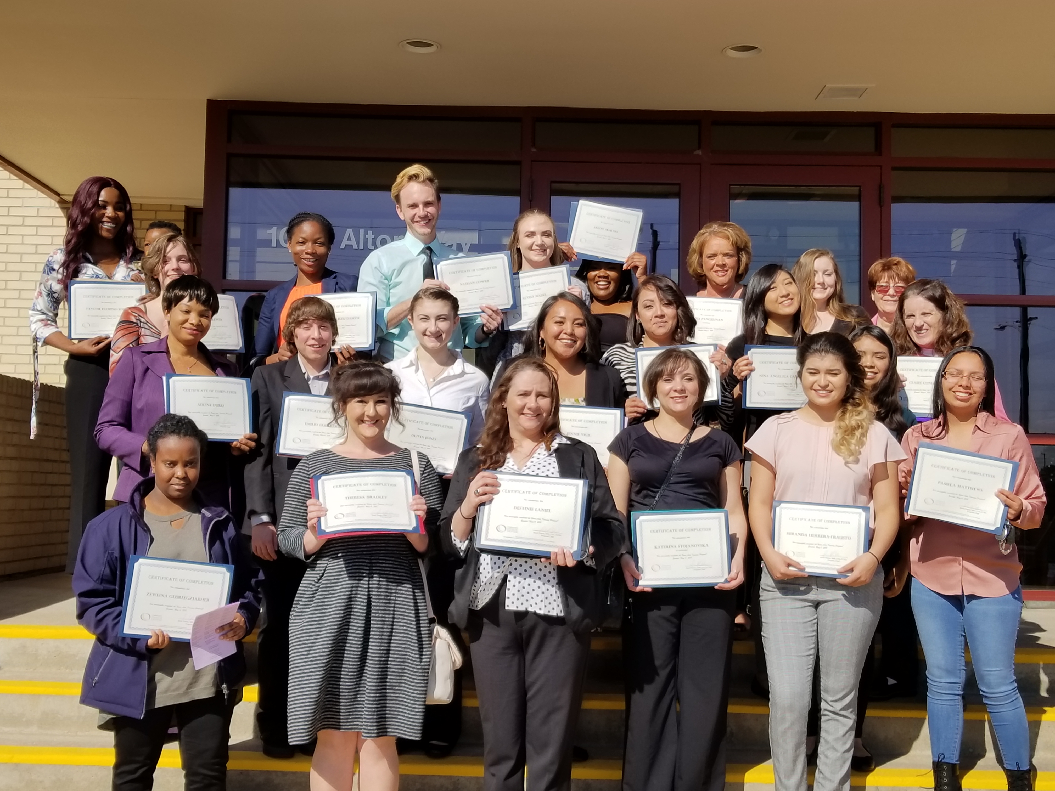 group of students holding certificates