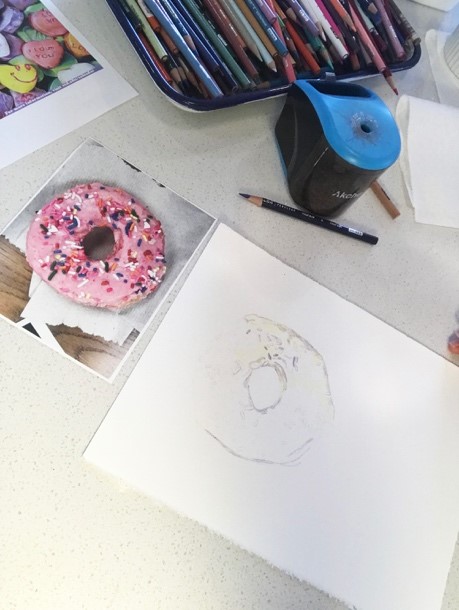 pink donut with sprinkles and sketch rendering of donut