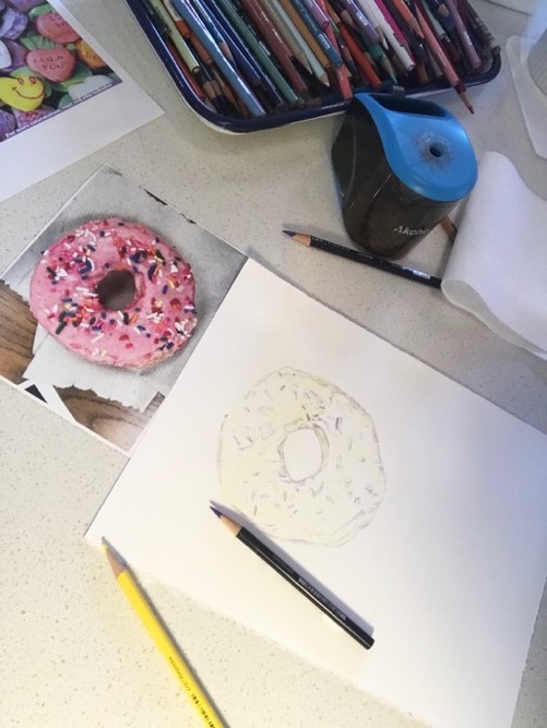 pink donut with sprinkles and sketch rendering of donut