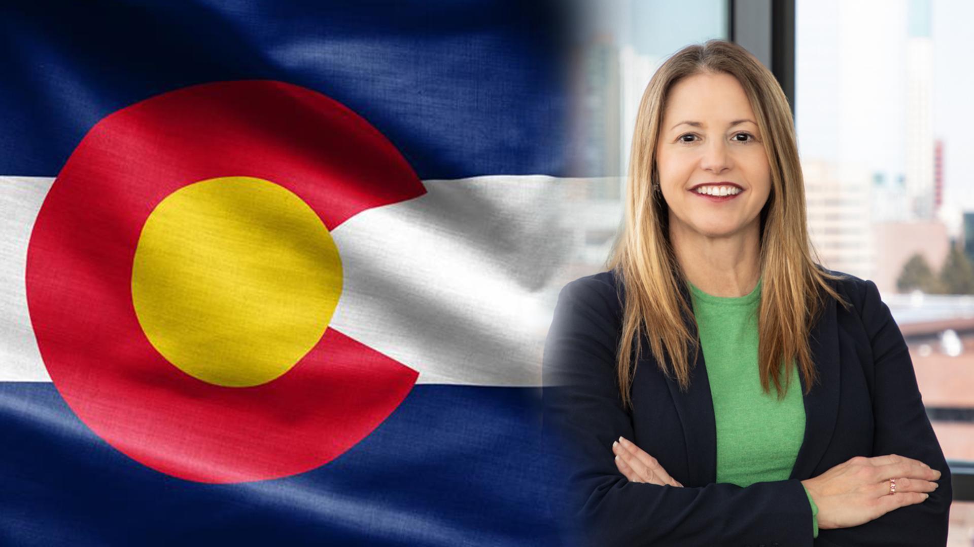 Dr. Marielena DeSanctis on the left. Colorado flag on the right.