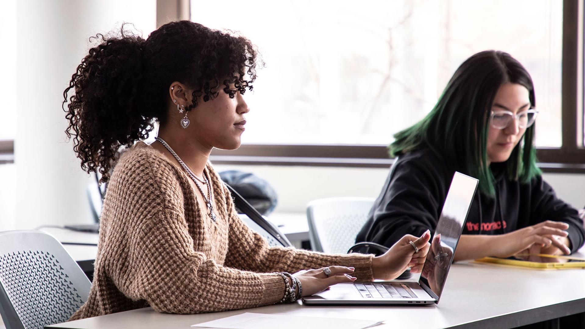 two girls working at desk