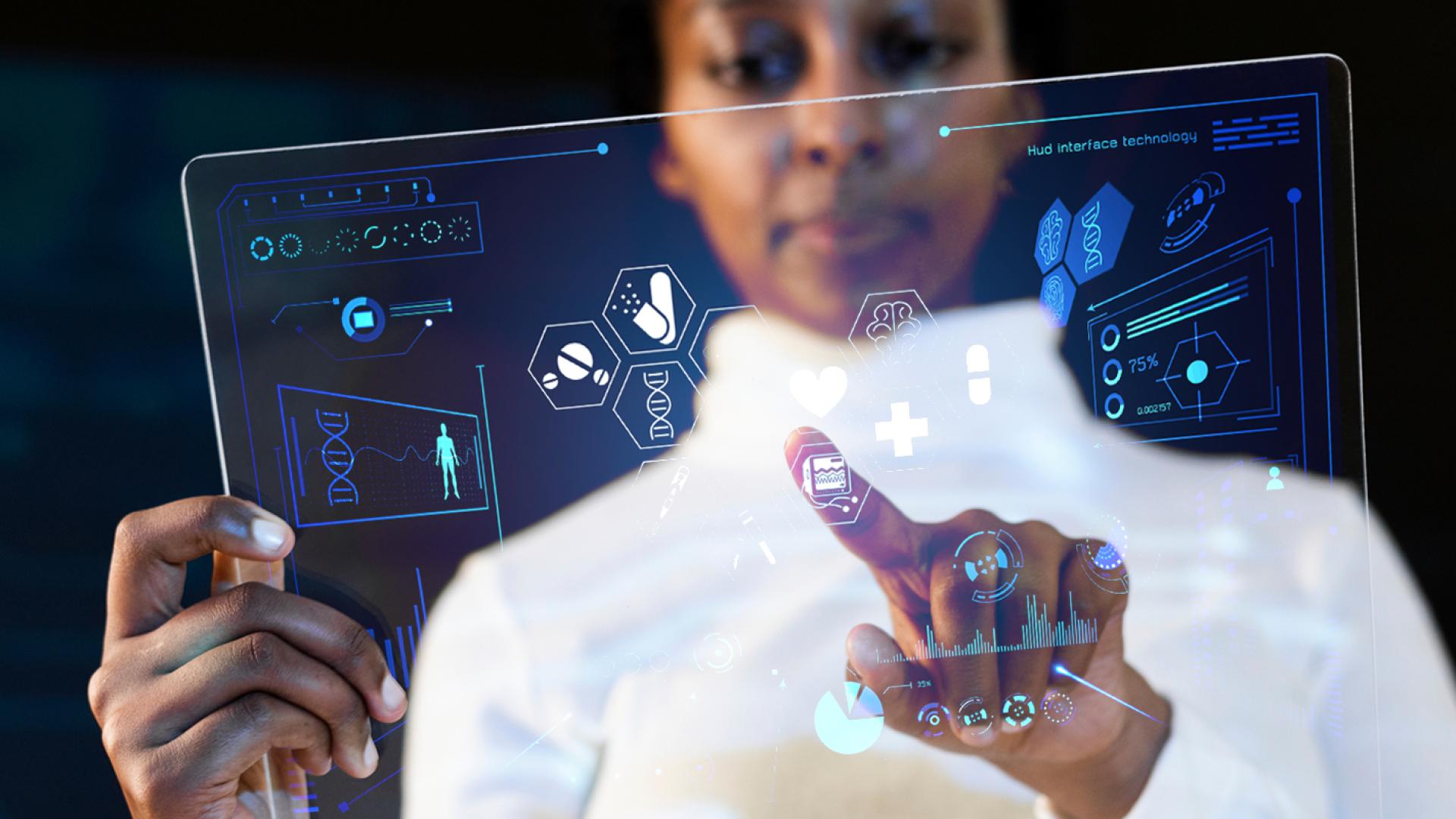 woman in white jacket touching translucent technology screen