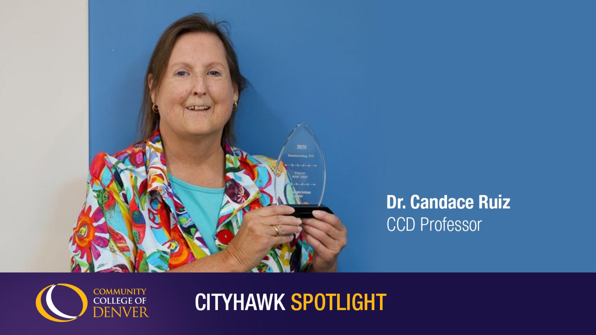 Image of Dr Candace Ruiz accepting an award with a blue background 